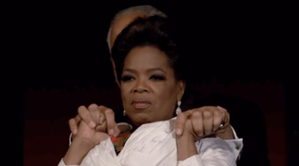 Oprah holding Stedman's hands