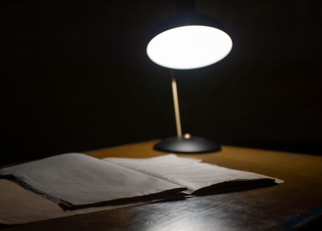 black table lamp beside book