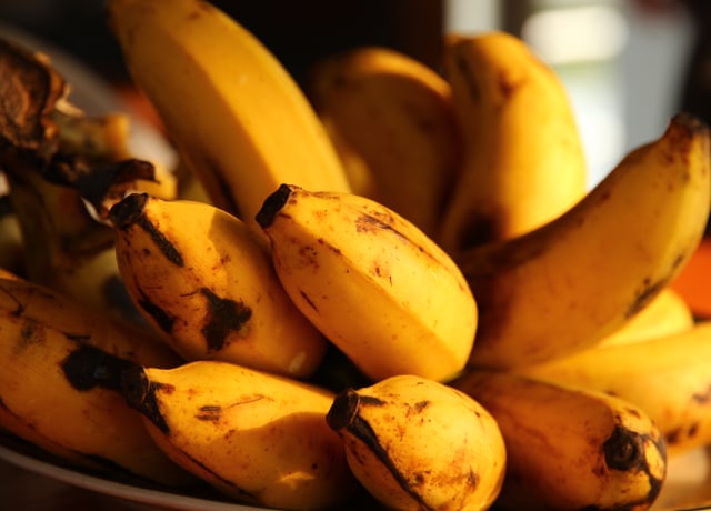 selective focus photography of ripped bananas