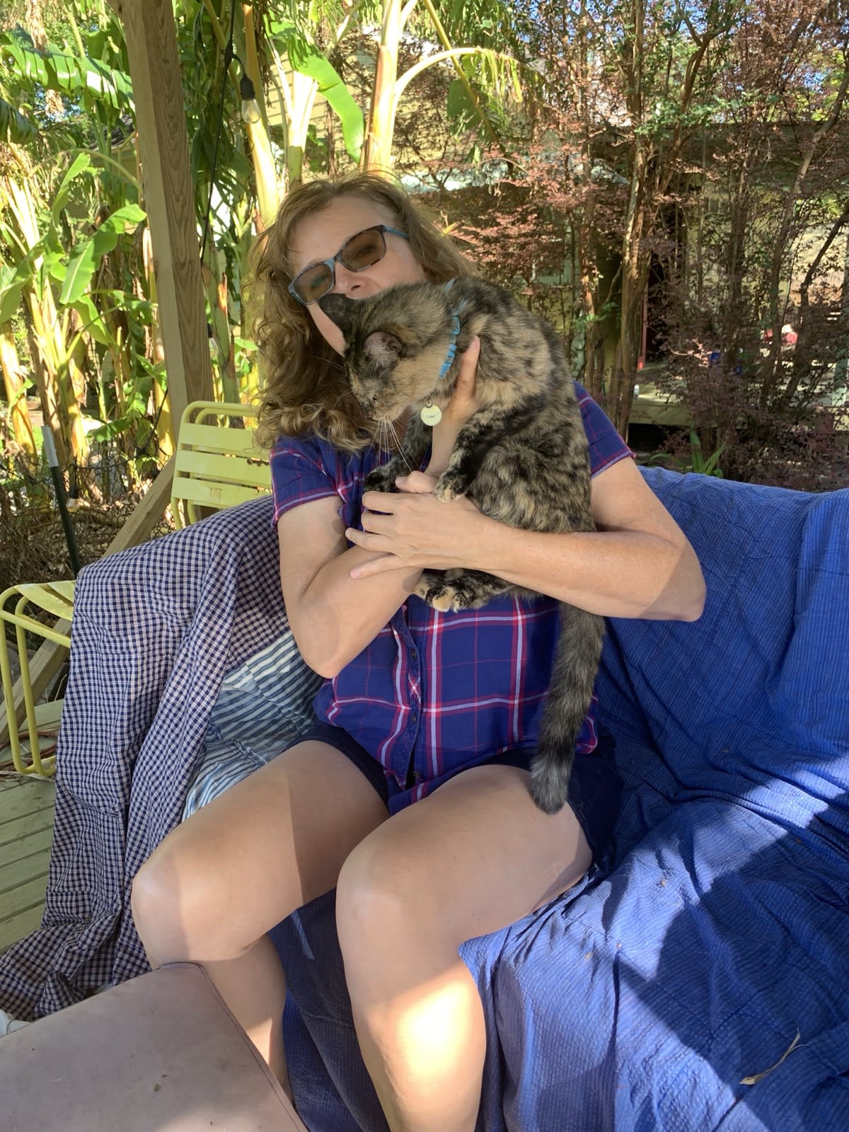 David Rhoden with a cat called Chesh. Gina Phillips with a cat called Chesh.