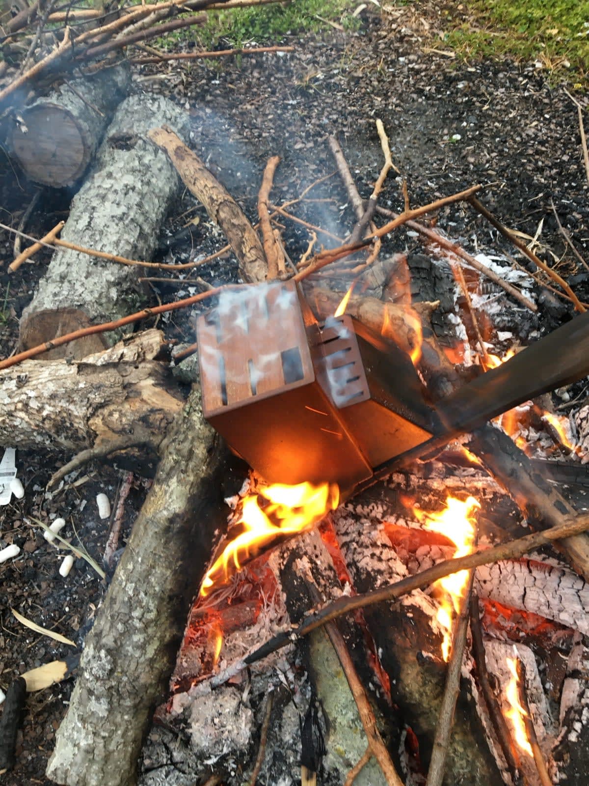 a knifeblock smoking in a bonfire a knifeblock smoking in a bonfire