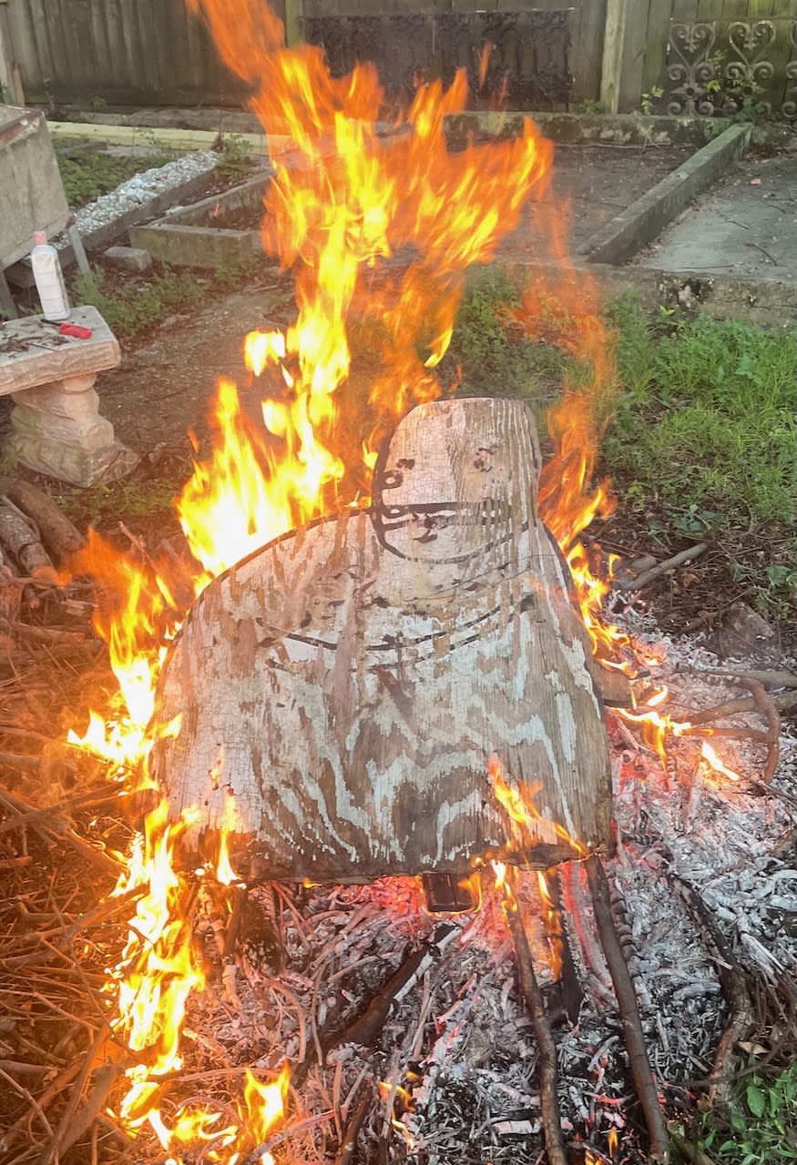 Art by David Rhoden burning in a bonfire