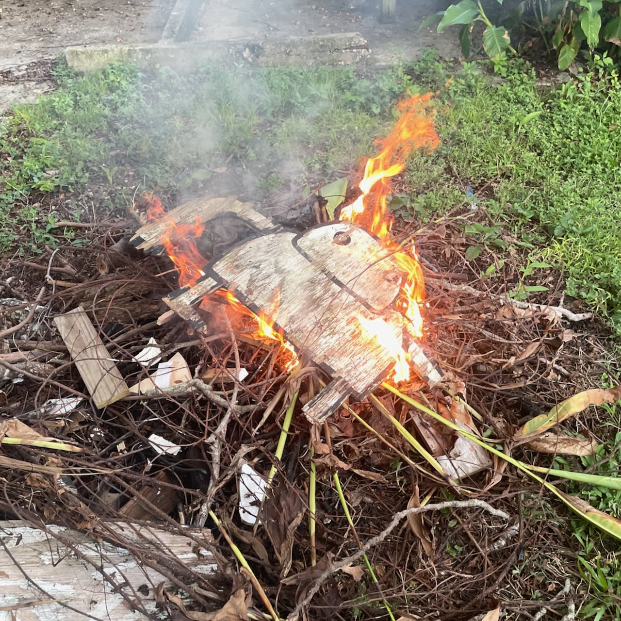 Art by David Rhoden burning in a bonfire