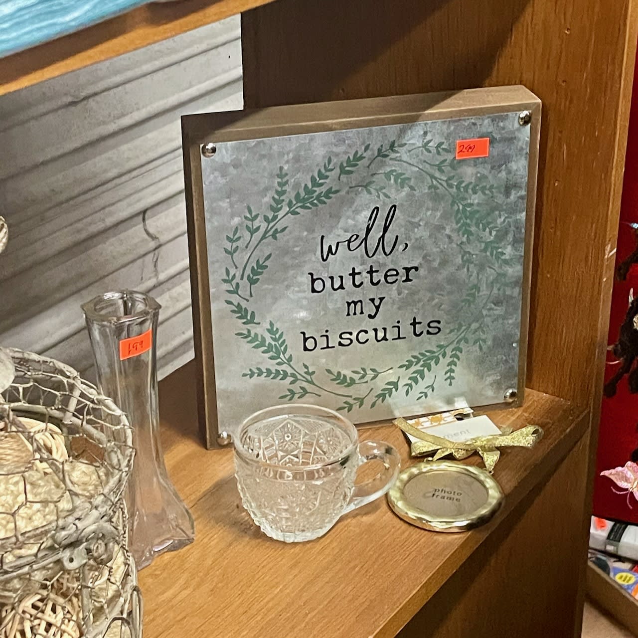 thrift-store plaque that says "well, butter my biscuits". ("Butter my biscuits" is a lyric from the Jimmy and The Wolfpack hit "Barnyard Boogie".)