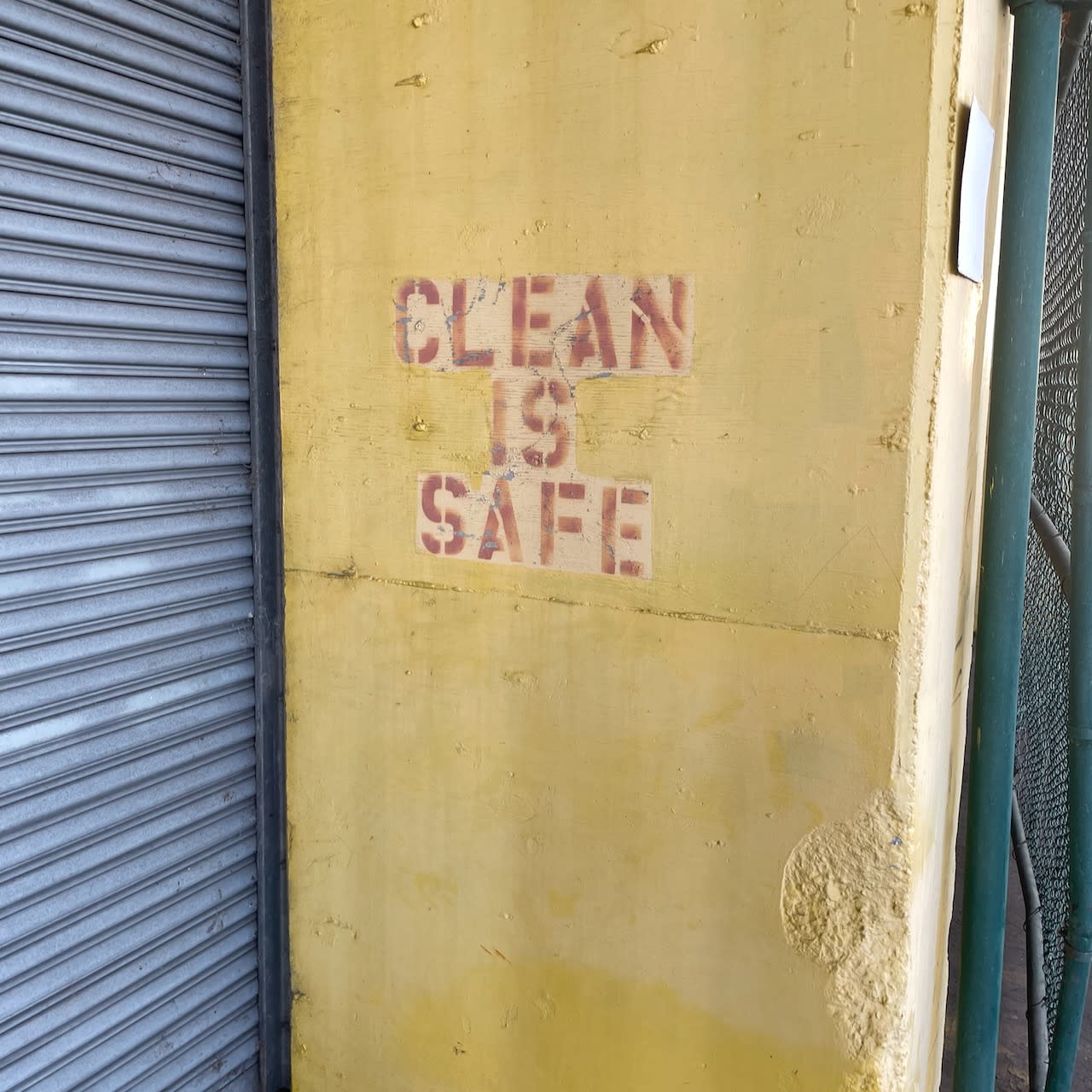stencil saying CLEAN IS SAFE.
