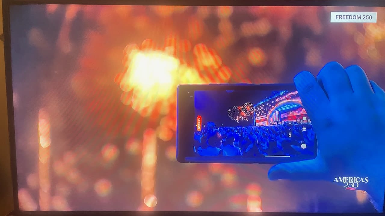 picture of someone filming fireworks, July, 4, 2026.