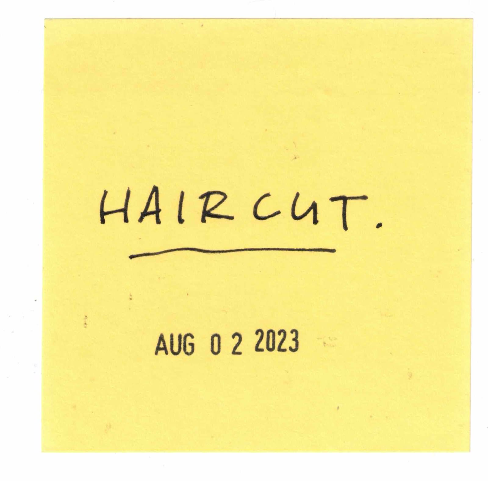 post-it that says haircut on it.