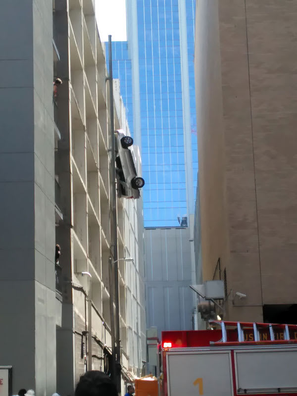 Car hanging from parking garage on Sixth Street in Austin, September 9, 2016. Car hanging from parking garage on Sixth Street in Austin, September 9, 2016.