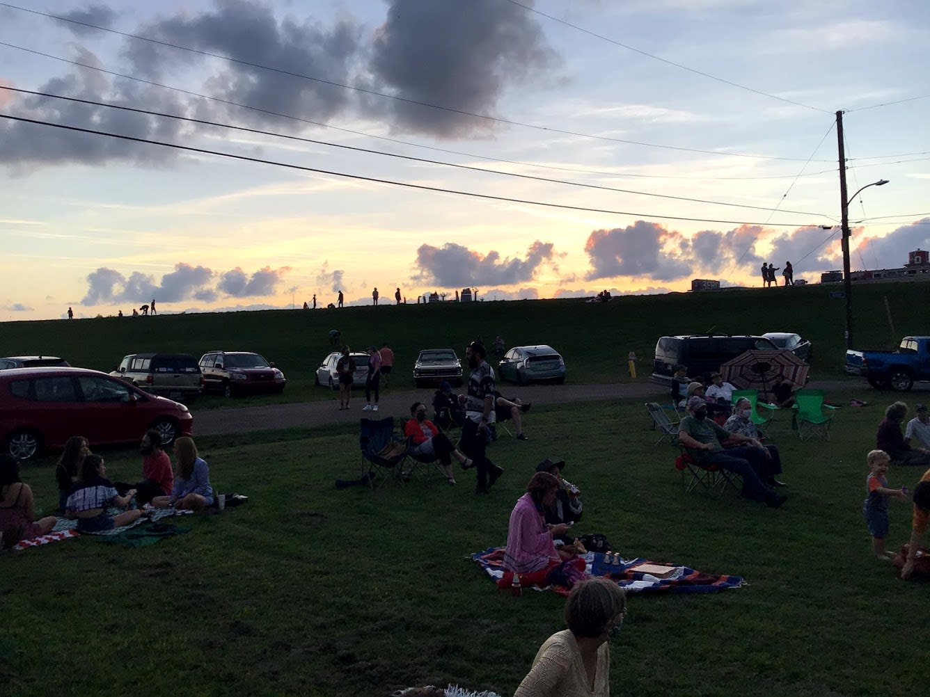 Levee watchers and clouds at Holy Cross Music Hang Levee watchers and clouds at Holy Cross Music Hang