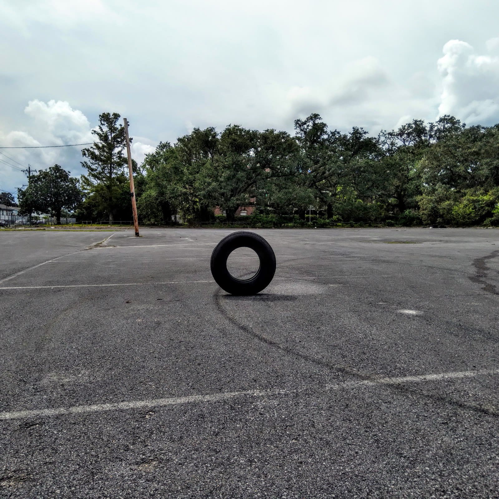 Standing tire in Holy Cross parking lot, New Orleans, Louisiana, October 5, 2021