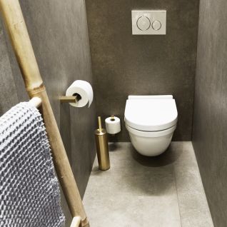 Gæstetoilet med Unidrains toilet tilbehør.