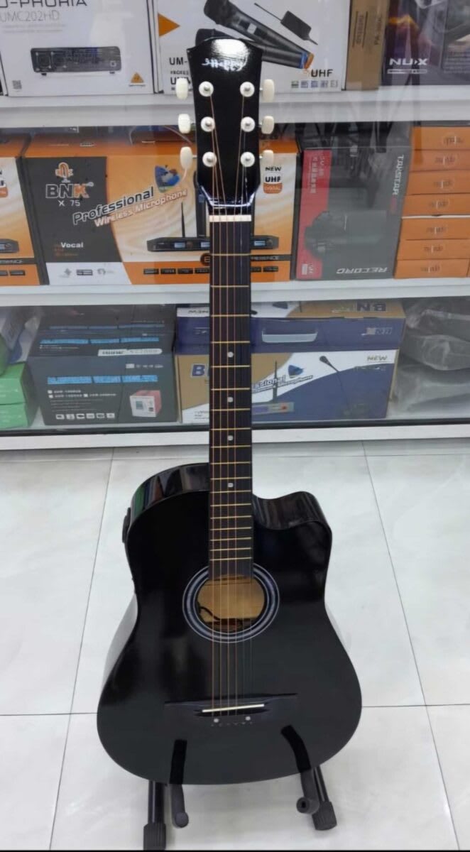 38-inch acoustic guitar with a cutaway body design