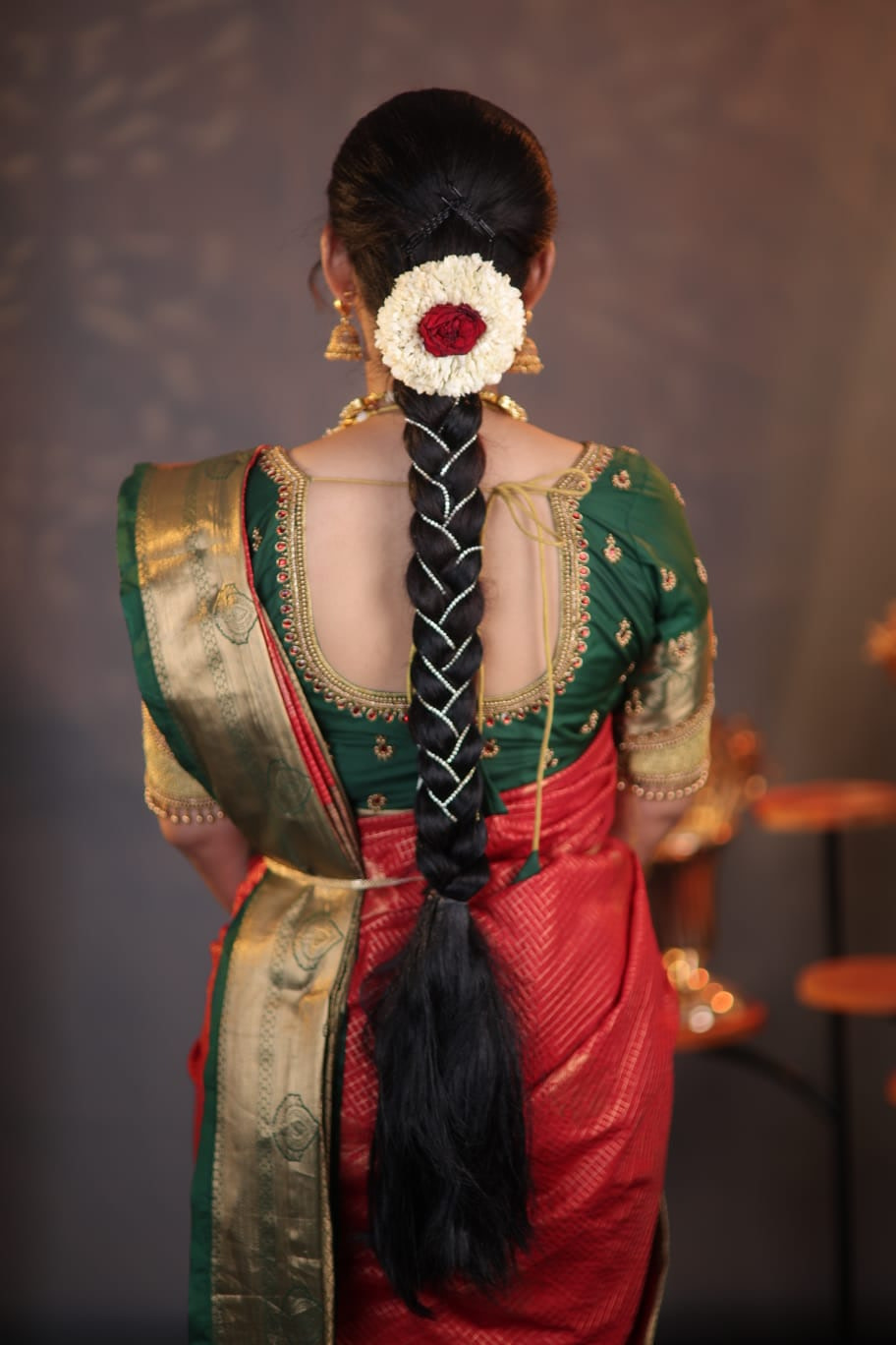 Traditional South Indian bridal braid with jasmine and rose jadai alangaram styled in Chennai