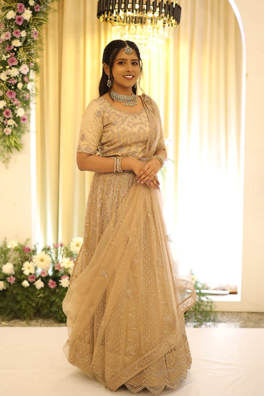 Bride in a draped silk saree at her wedding venue in Chennai