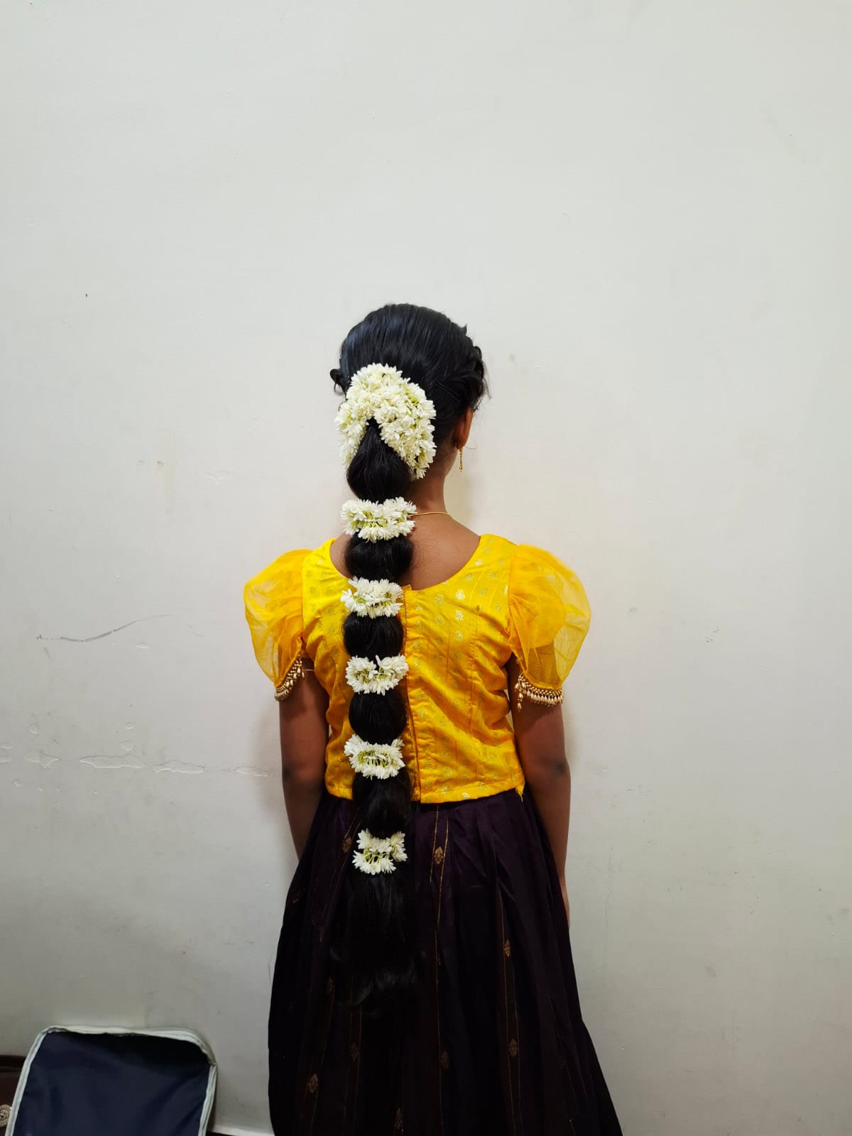 Floral bridal bun with jasmine gajra styled in Chennai