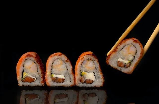 fours sushi rolls on a transparent plate