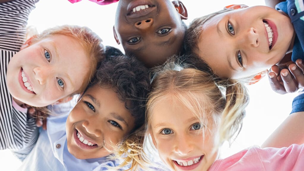 Children gathered in a circle in children's ministry