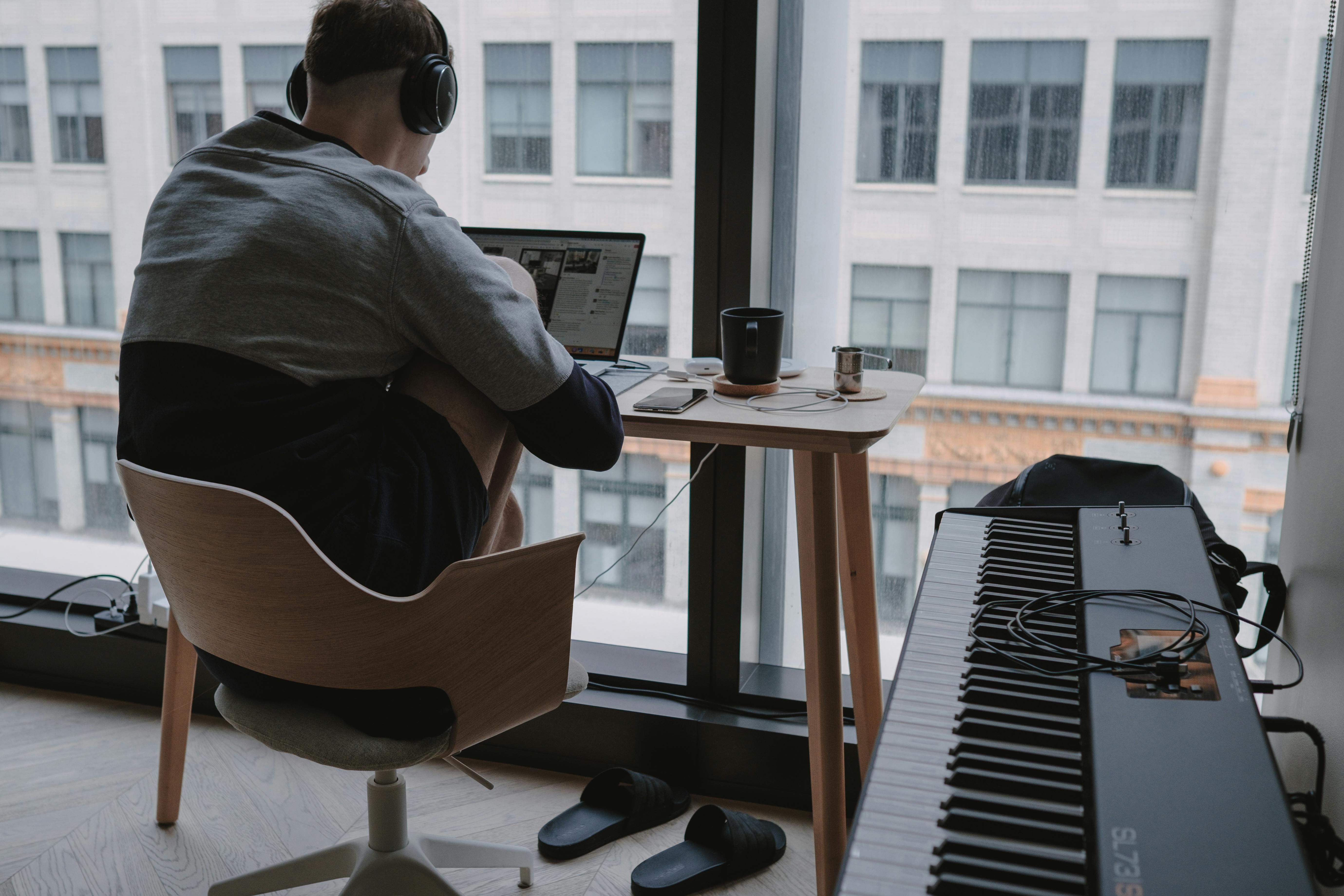 pexels-photo-4057060-4057060 Minimalist home office setup with a laptop and piano, ideal for remote work and digital nomads.