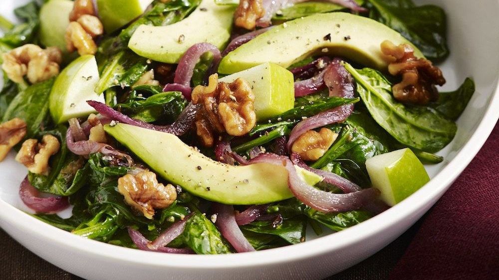 Wilted Spinach Salad With Grilled Onions, Walnuts, Avocado, And Apple