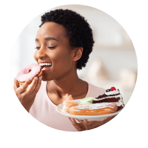 black woman eating doughnuts