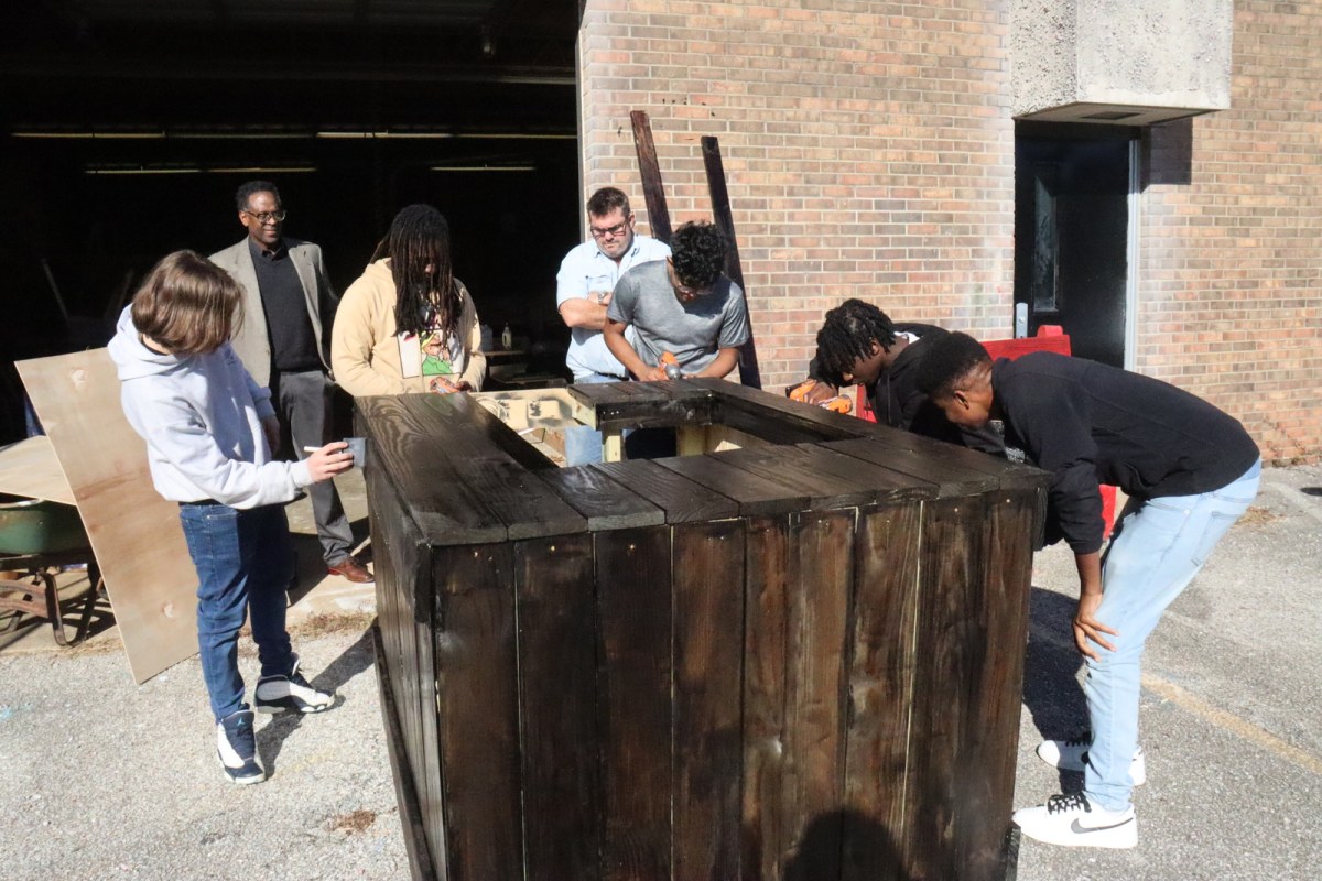 Talladega High School students construct cocoa stands for Christmas on the Square