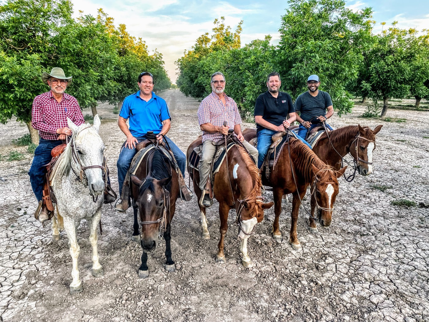 Guys riding horses