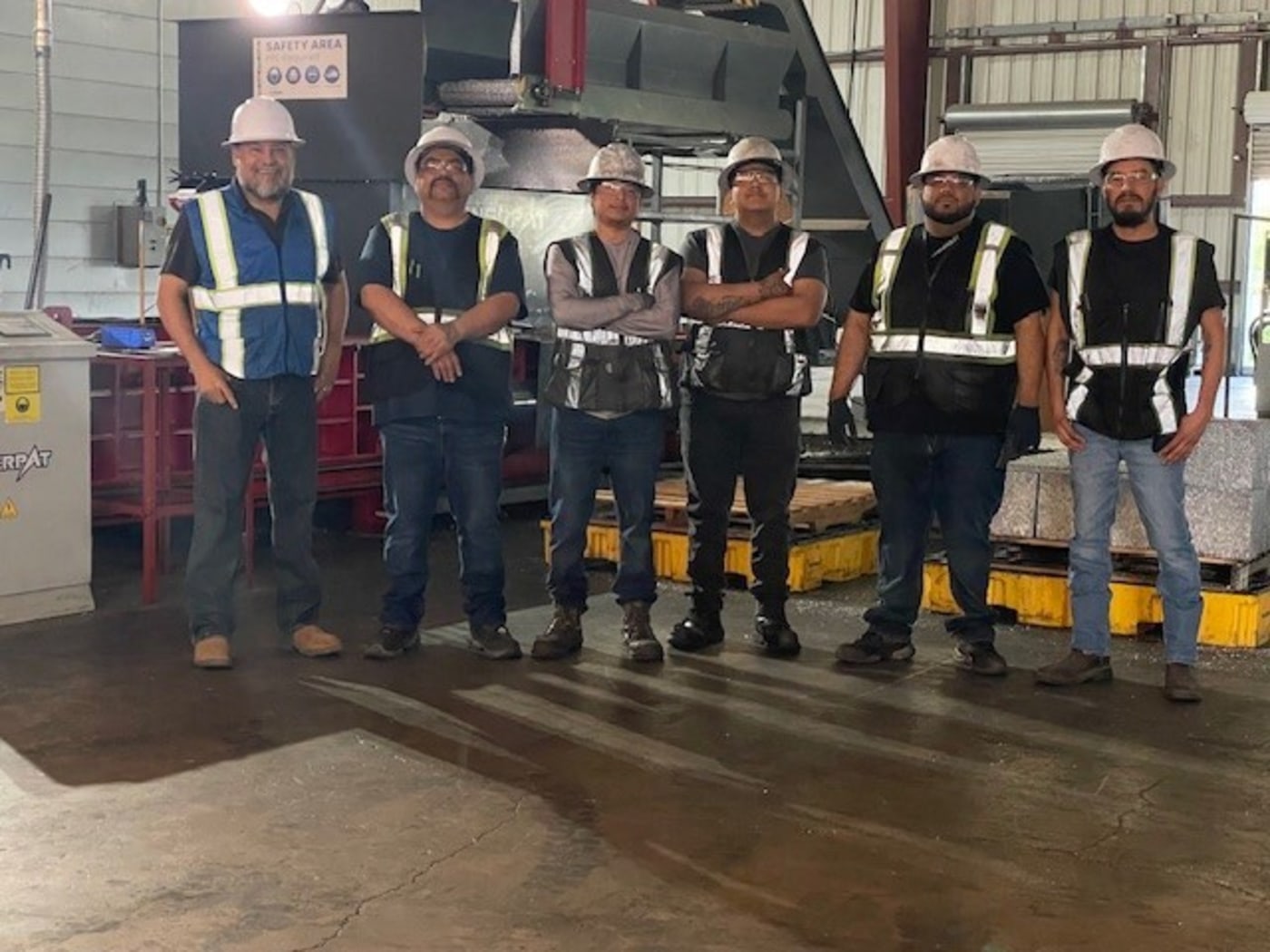 People wearing vests and hard hats
