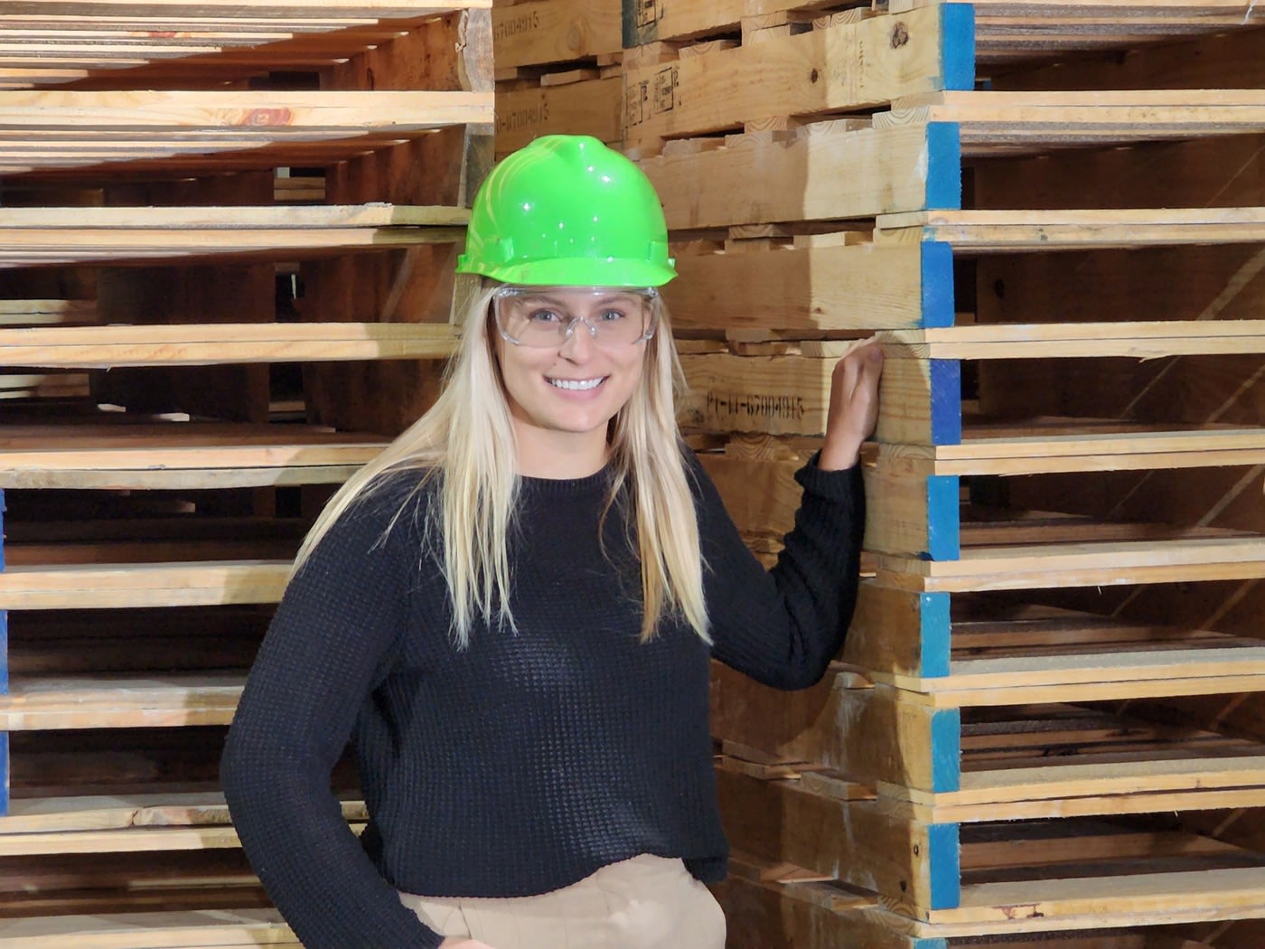 Lady in green hard hat