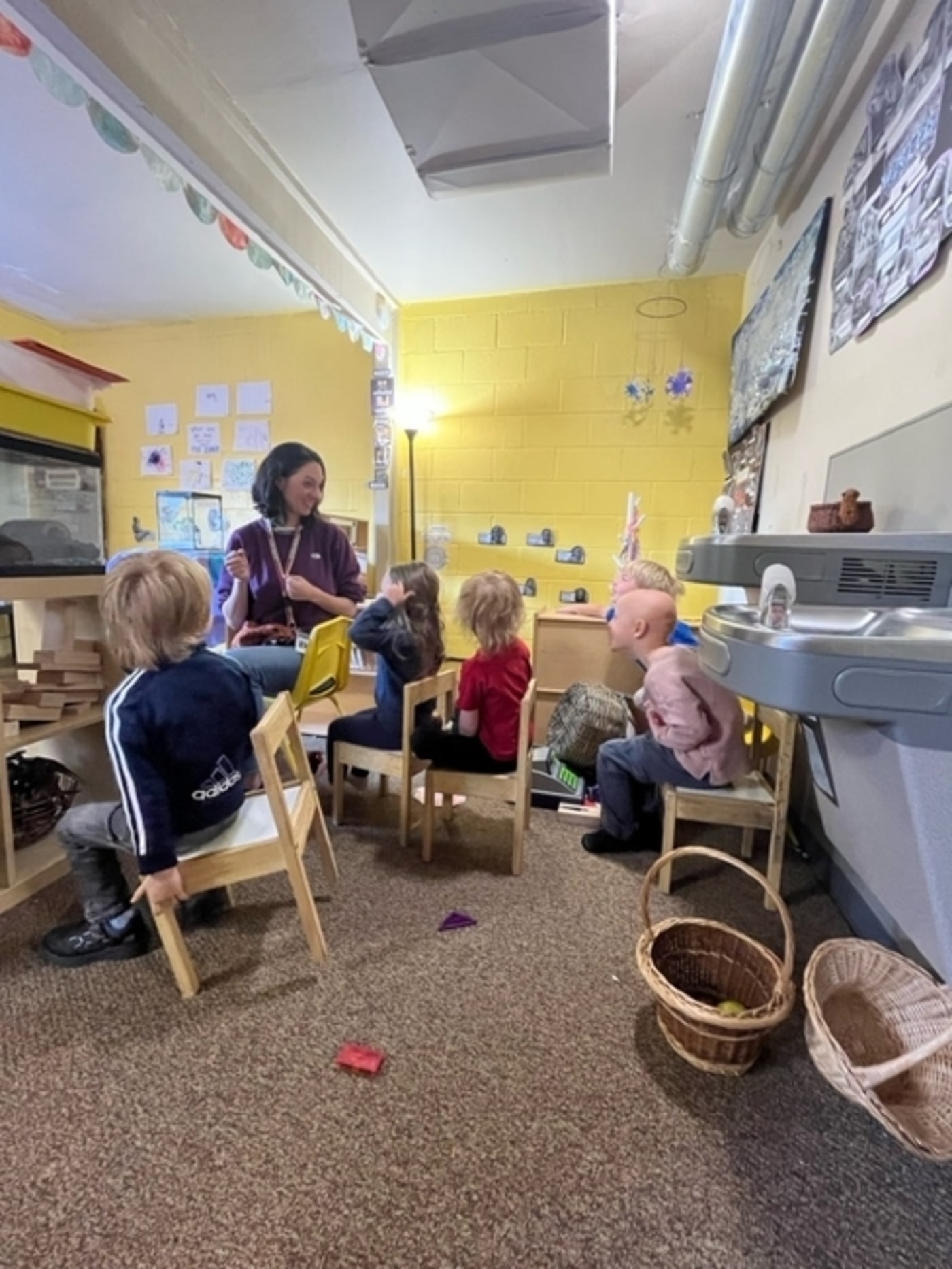 Teacher teaching children at a daycare center