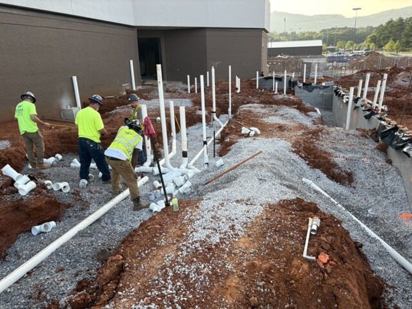 2 men working on a pipe