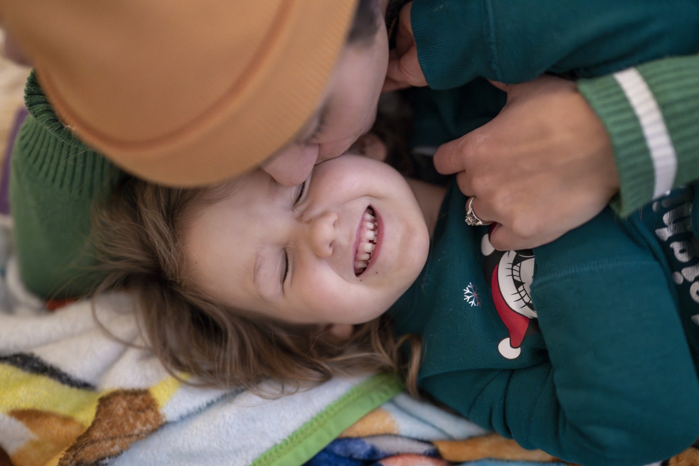 Woman kissing child on the cheek