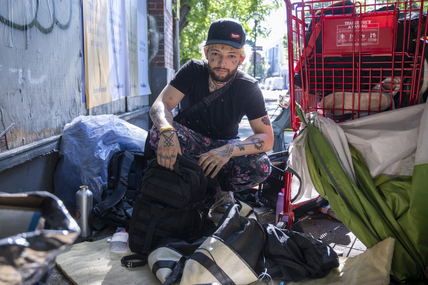 Homeless man with his belongings