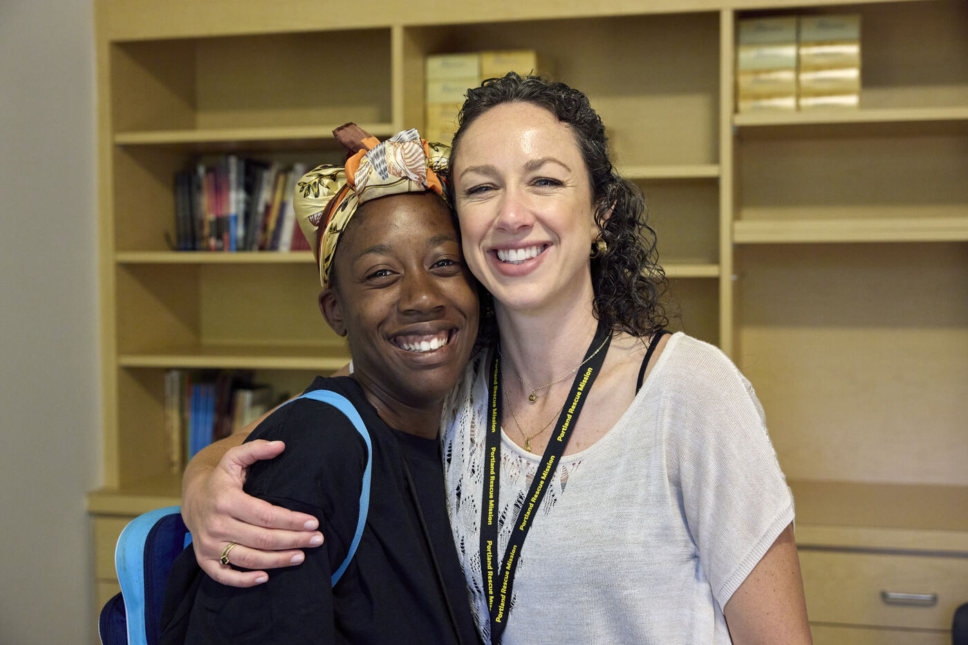  Two women hugging and smiling 