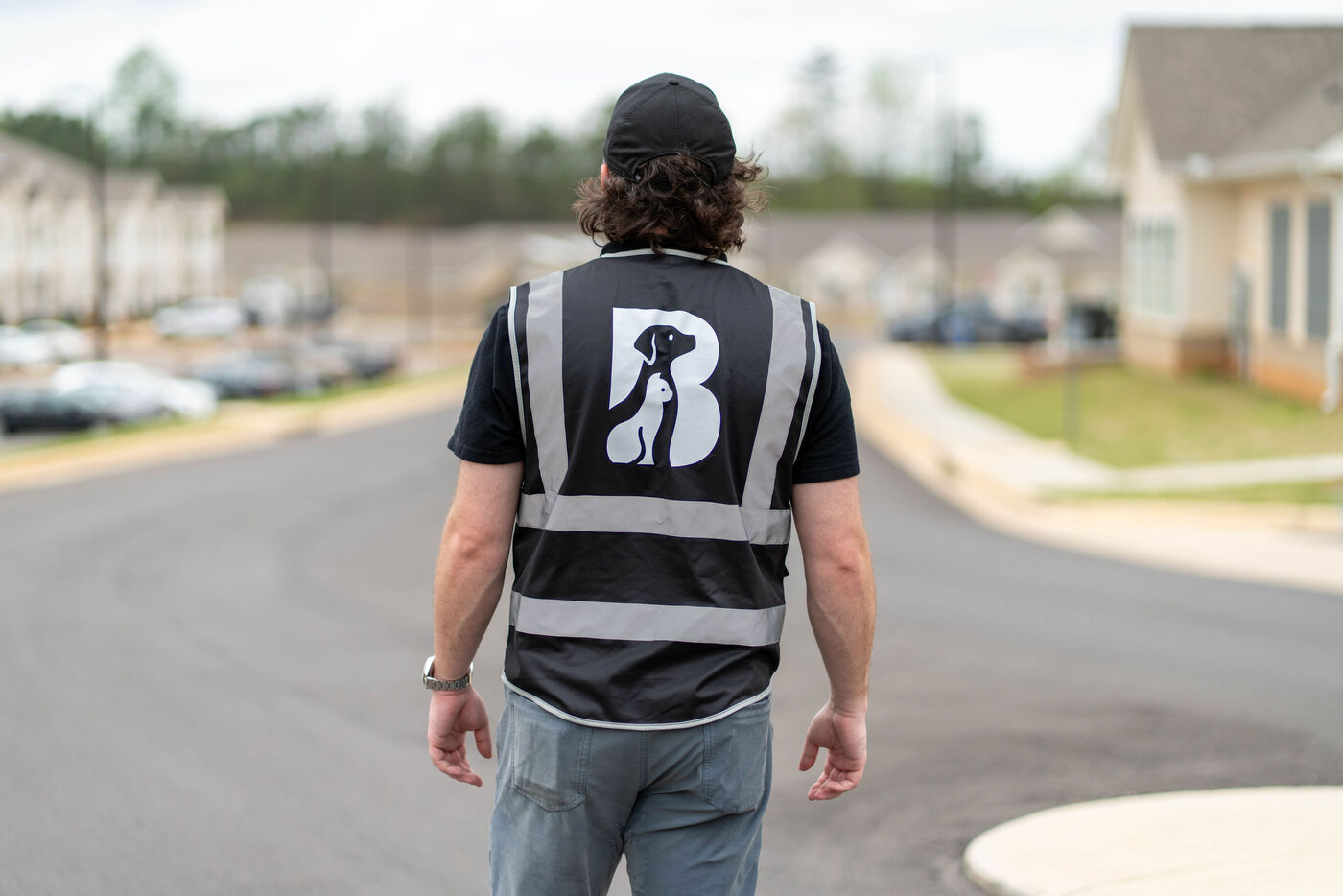 Man's back who is wearing a Black Warrior Pet vest