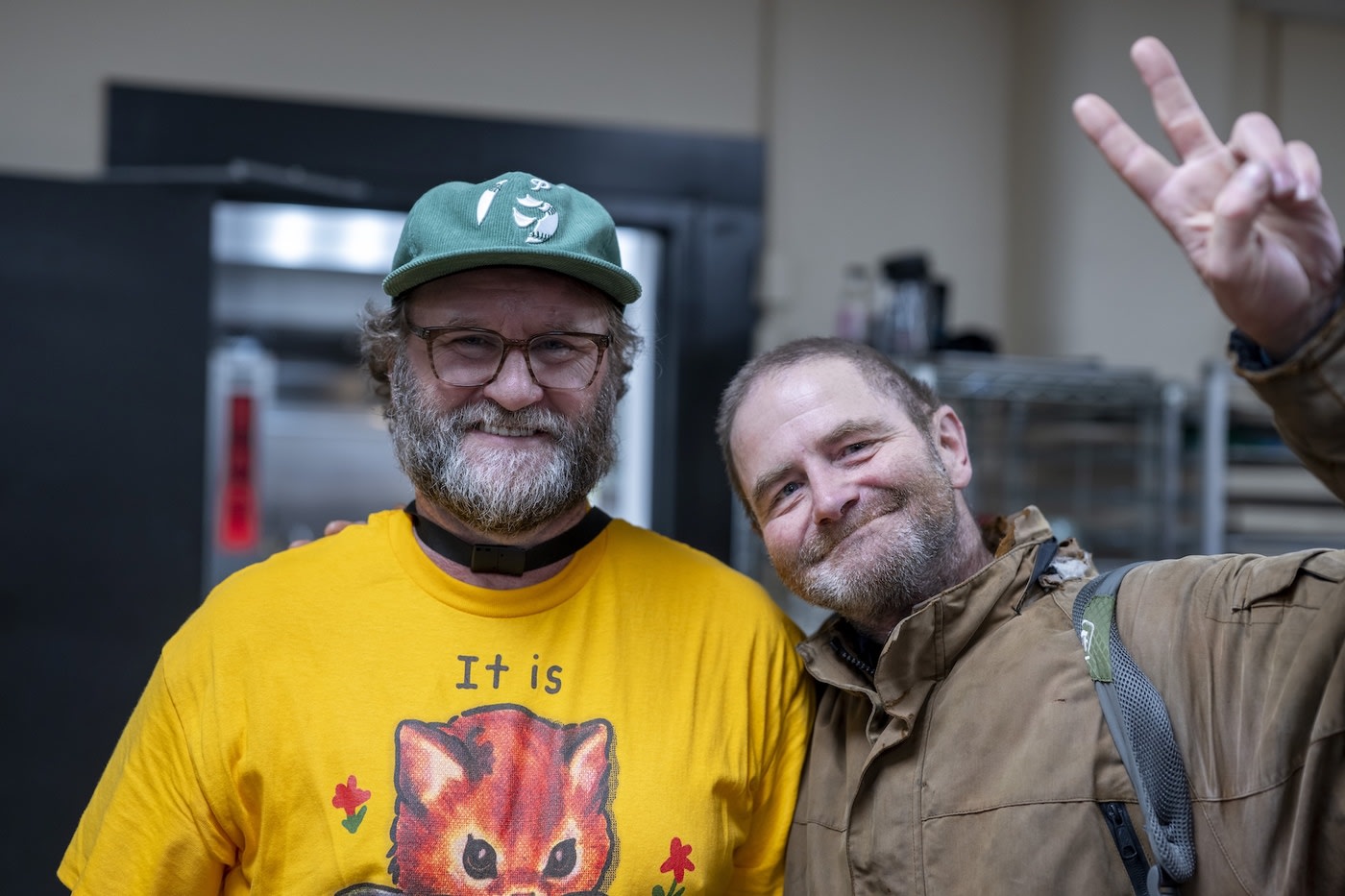 Two men smiling at Portland Rescue Mission (PRM)