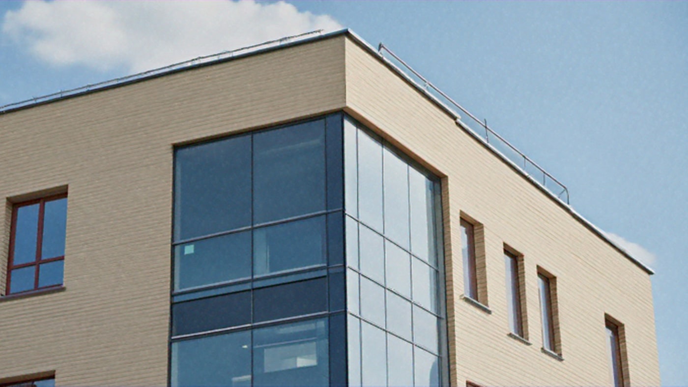 Corner of a building with a lot of windows