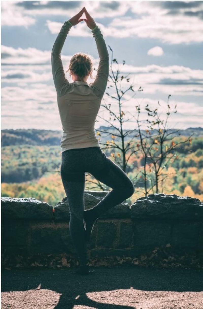 Girl Standing in Front of Mountains