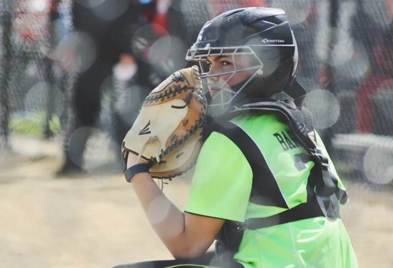 Media > Media > Catcher Playing Softball-Low Back Pain Treatment