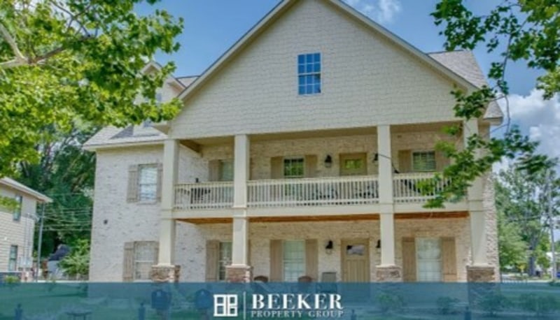 Cream Colored 2 Story House Multi Family Icon