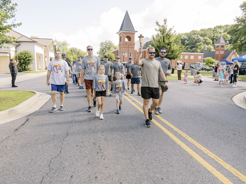 Law Enforcement Torch Run for Special Olympics lights up Oxford‘s Main Street