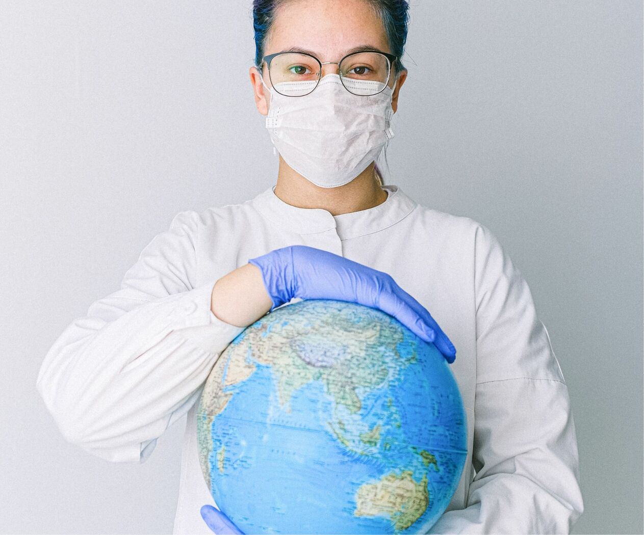 Nurse Holding Globe