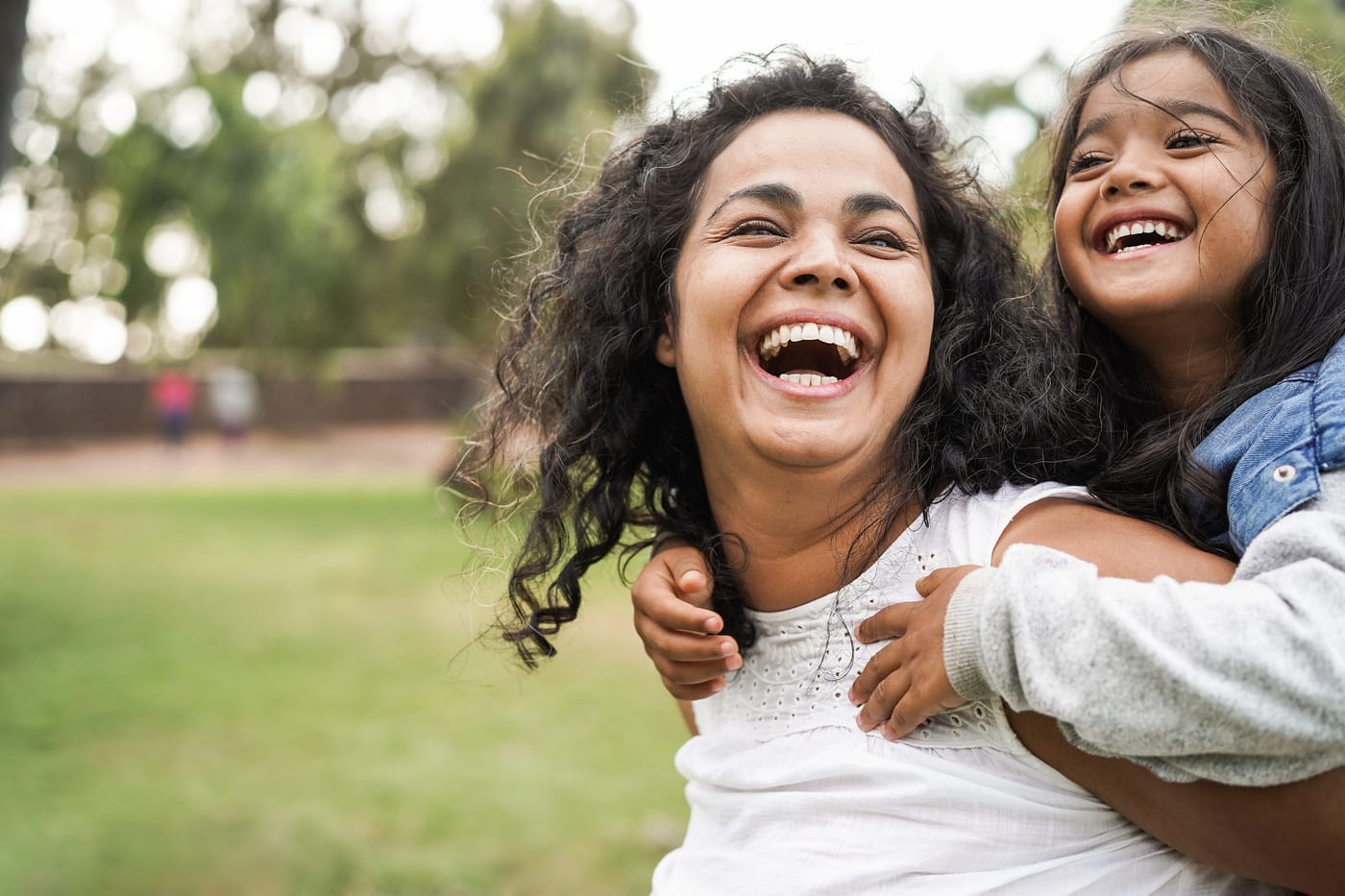 Mom with daughter on her back