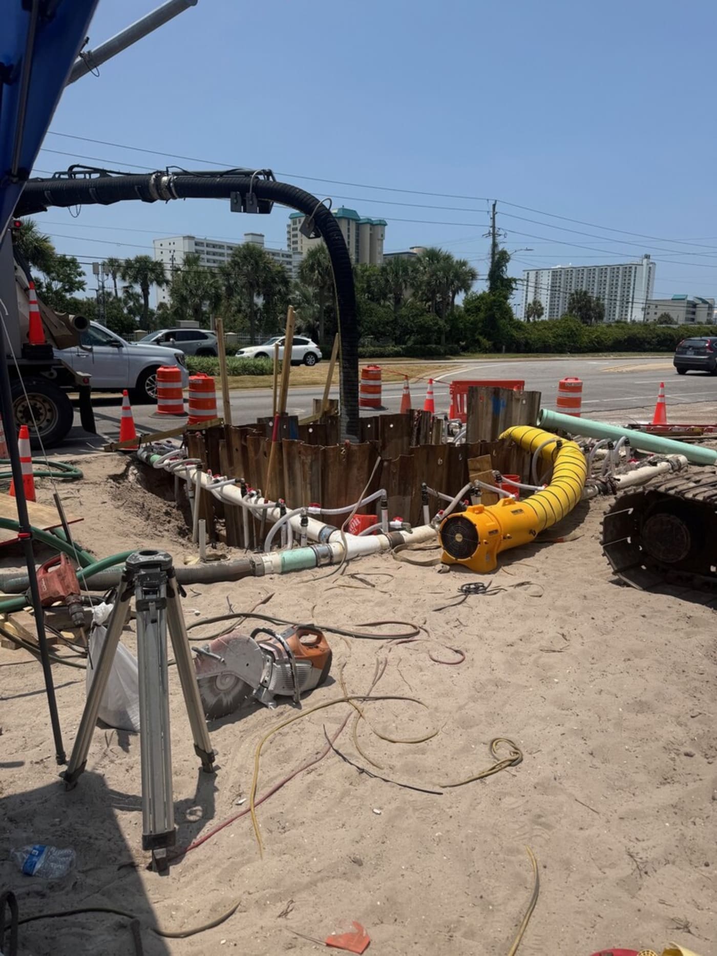 Construction worker welding a water pipe for repair