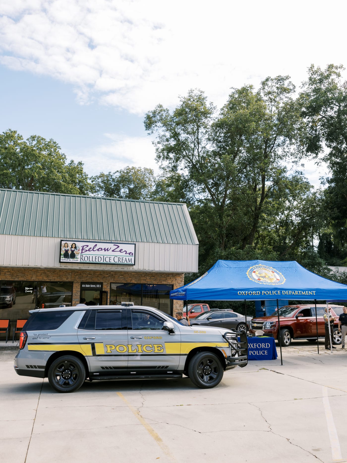 Badges and ice cream mix at law enforcement social