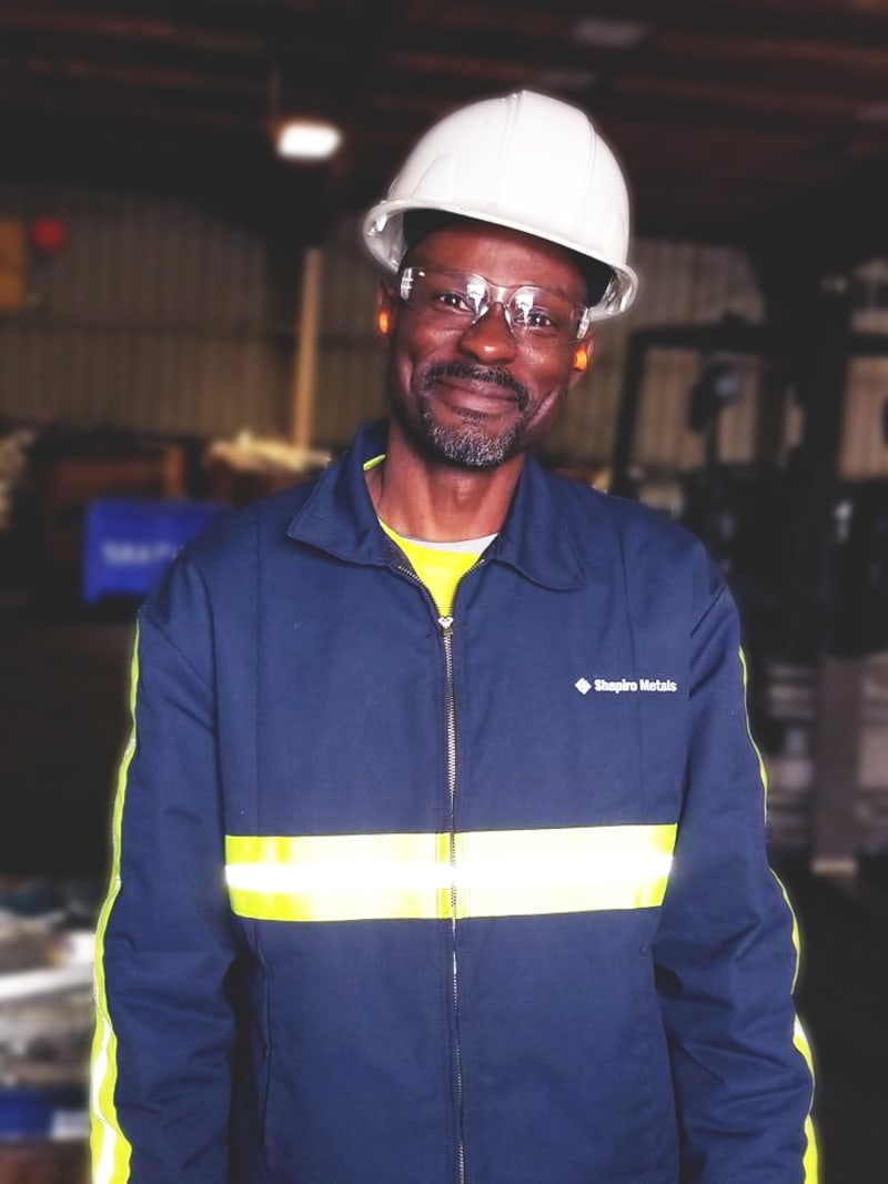 Man in hard hat and blue zip up