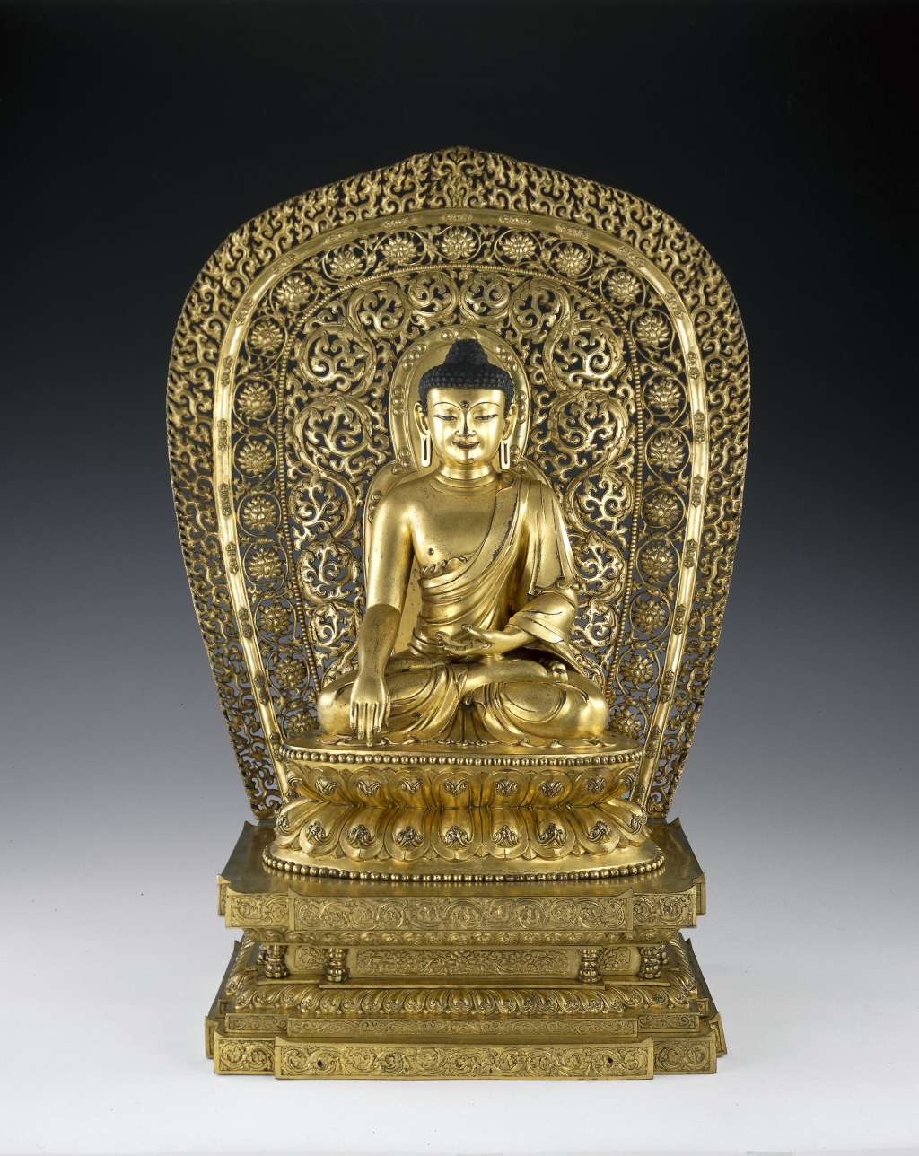 Gilt bronze Buddha figure with six-character Yongle mark. Height 37 cm.  1908,0420.4. Copyright, The Trustees of the British Museum. (Throne and halo believed to be of the Qing dynasty)