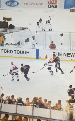 Gretzky chasing the puck while CSC staff record weather data in the background