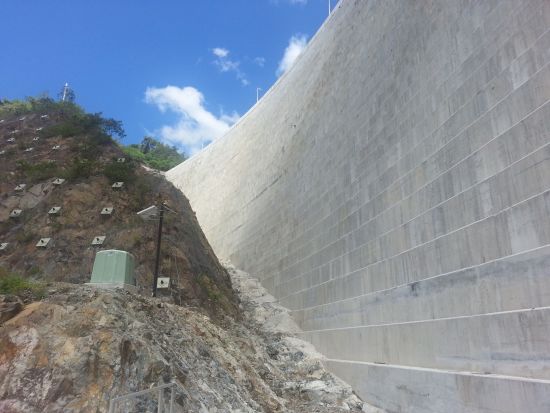 Slope near dam with monitoring equipment