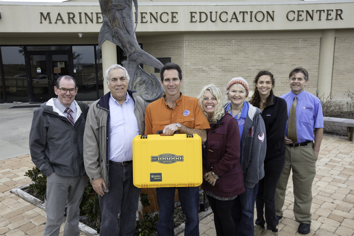 Mission-Aransas NERR employees with golden datalogger case