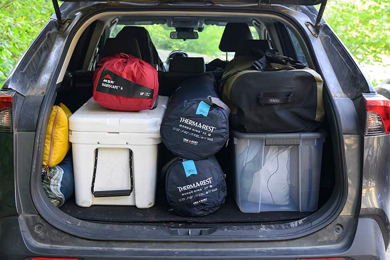 An open hatchback filled with camping gear showing the packed size of the Mondoking